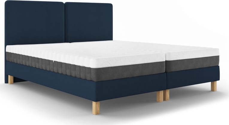 Tmavě modrá čalouněná dvoulůžková postel s roštem 160x200