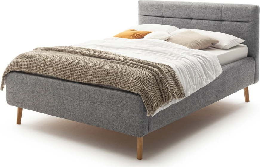Šedá čalouněná dvoulůžková postel s úložným prostorem s roštem