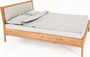 Dvoulůžková postel z dubového dřeva s čalouněným čelem